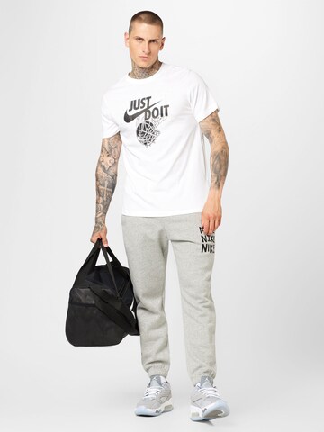 Nike Sportswear Zwężany krój Spodnie w kolorze szary