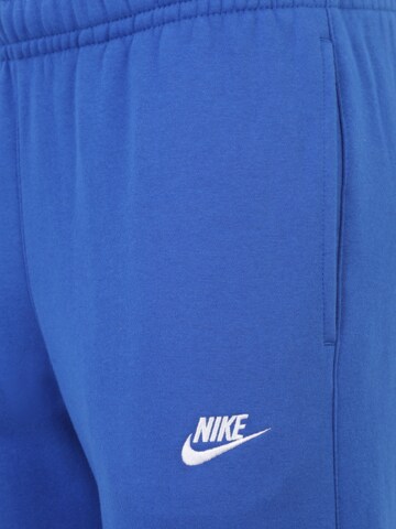 Nike Sportswear Zwężany krój Spodnie 'Club Fleece' w kolorze niebieski