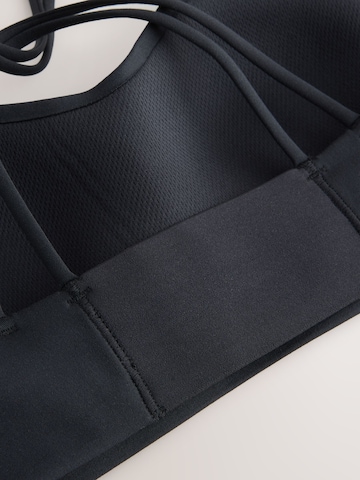 Next Bustier Urheilurintaliivit värissä musta