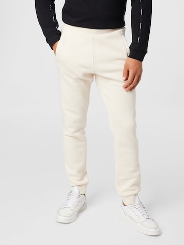 ADIDAS ORIGINALS Tapered Pants 'Adicolor Essentials Trefoil' in White: front