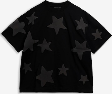 OVER STREET - Camisa 'Camiseta negra falling stars oversized tee' em preto: frente