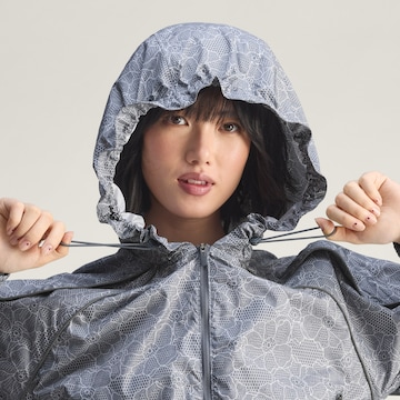 ADIDAS BY STELLA MCCARTNEY Urheilutakki ' Running Print' värissä harmaa