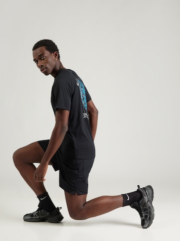 NIKE Λειτουργικό μπλουζάκι 'DFADV STRIDE ENERGY' σε μαύρο
