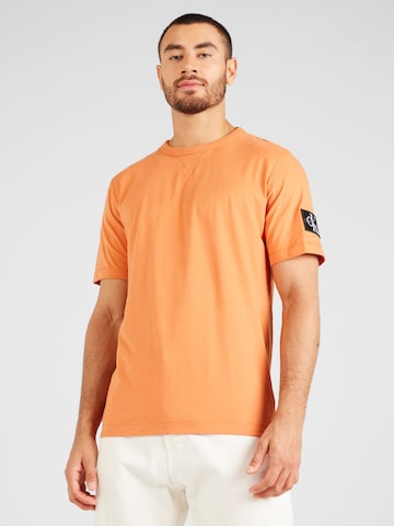 Calvin Klein Jeans Μπλουζάκι σε πορτοκαλί: μπροστά