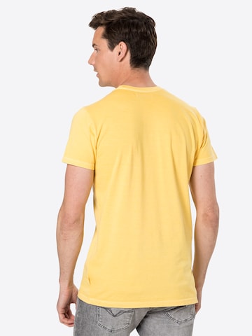 T-Shirt Revolution en jaune