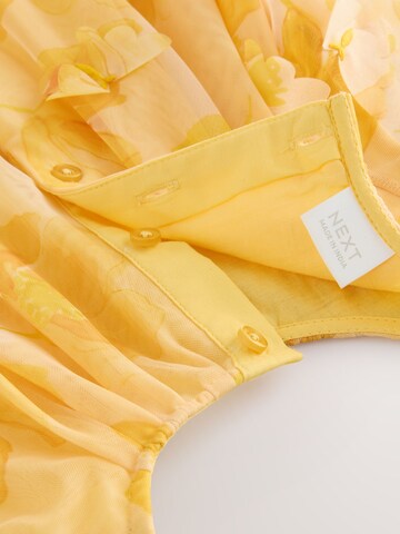 Robe Next en jaune