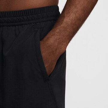 NIKE Regular Sports trousers in Black