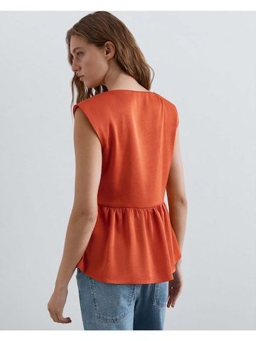 Haut Scalpers en orange
