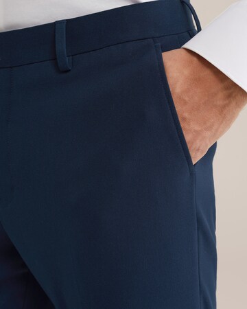 WE Fashion Slimfit Kalhoty s puky – modrá