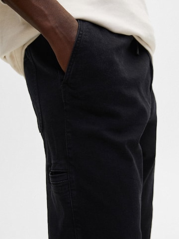 Pull&Bear Tapered Jeans in Zwart