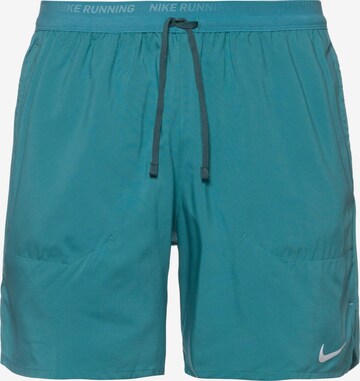 NIKE Workout Pants in Blue: front