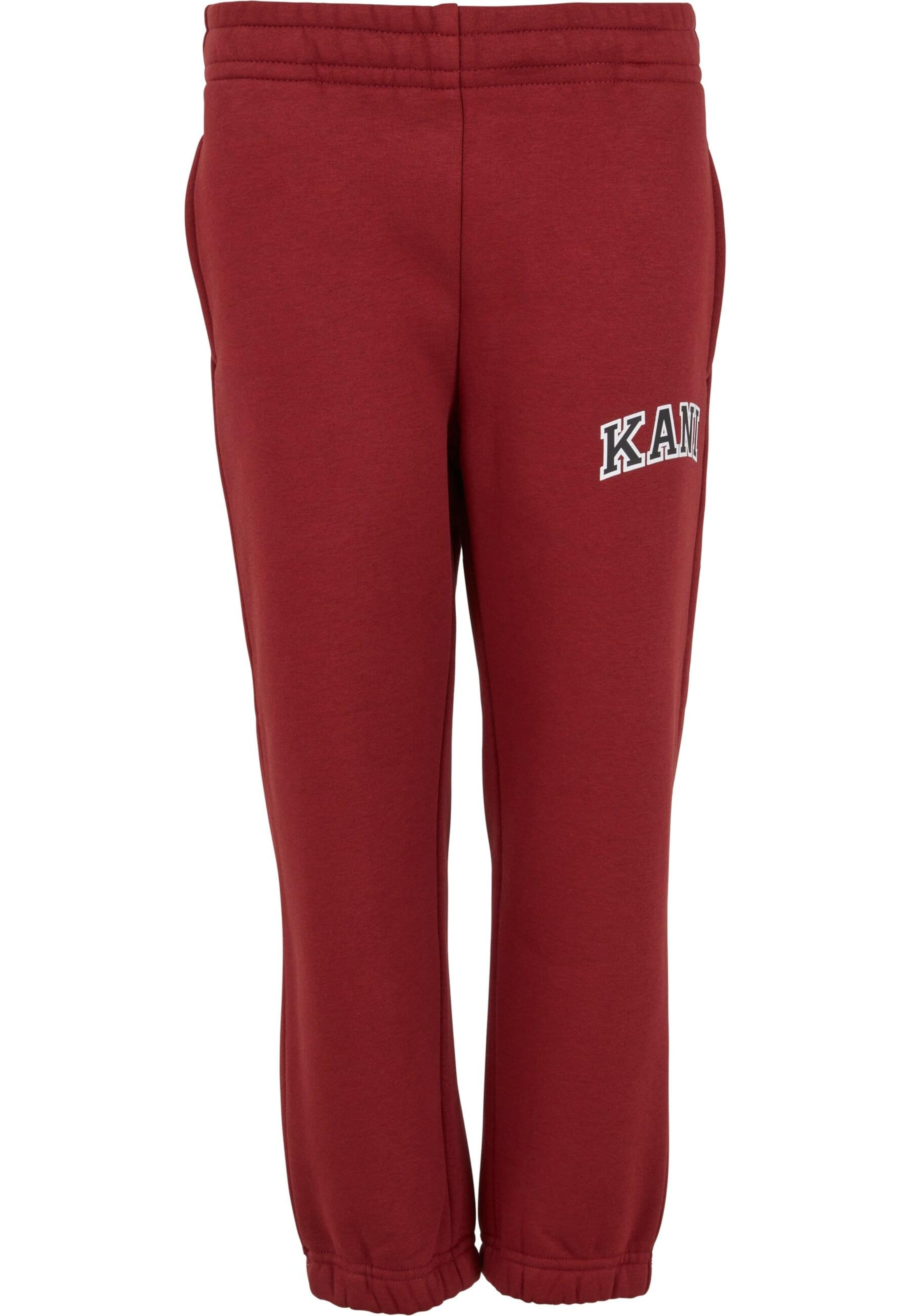 Karl Kani - Tapered Pantalón 'Serif' en rojo: frente