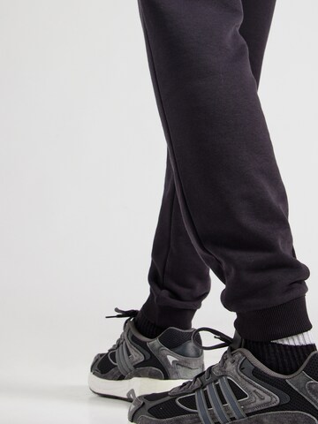 Tapered Pantaloni sportivi di Reebok in nero