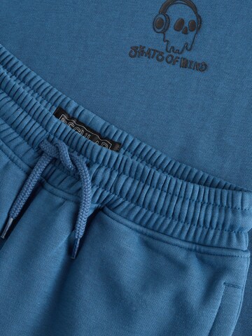 Set Next en bleu