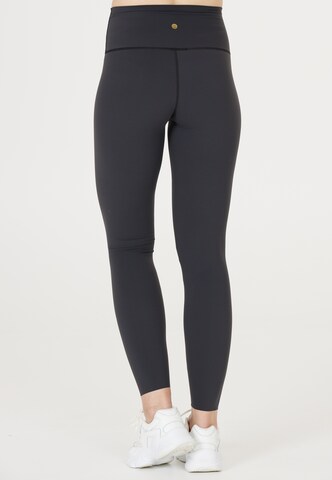 Athlecia Skinny Tights 'Stay' in Schwarz