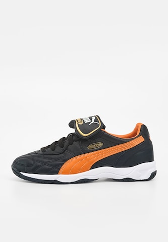 Chaussure de foot 'King' PUMA en noir : devant