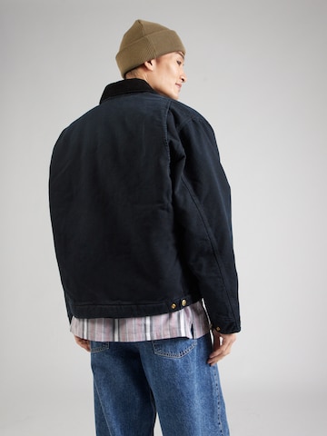 Carhartt WIP Välikausitakki 'Detroit' värissä musta