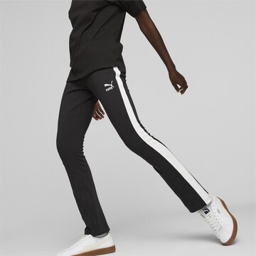 PUMA Skinny Leggings in Black: front