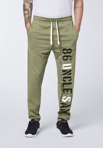 UNCLE SAM Tapered Pants in Green: front