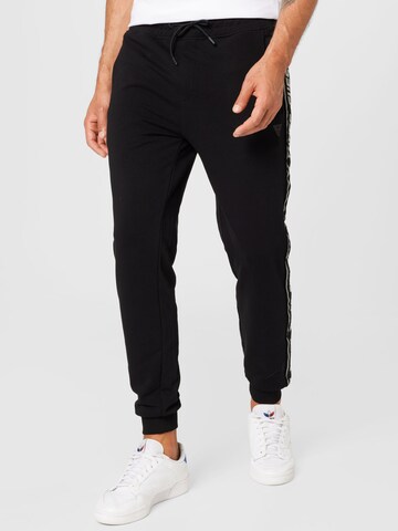GUESS Tapered Pants in Black: front