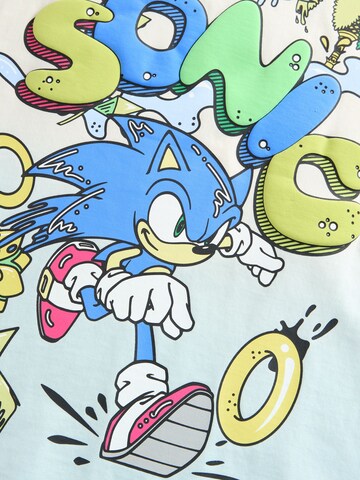 Tricou de la Next pe bej