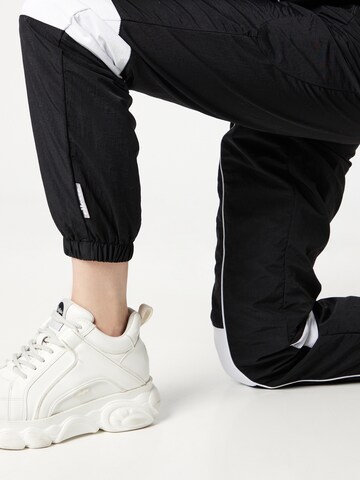 ELLESSE Дънки Tapered Leg Спортен панталон 'Noise' в черно