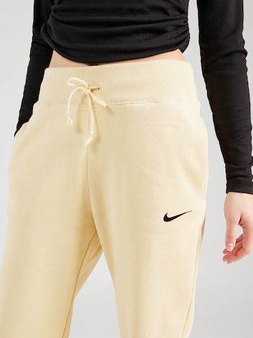 Nike SportswearTapered Hlače 'Phoenix Fleece' - žuta boja