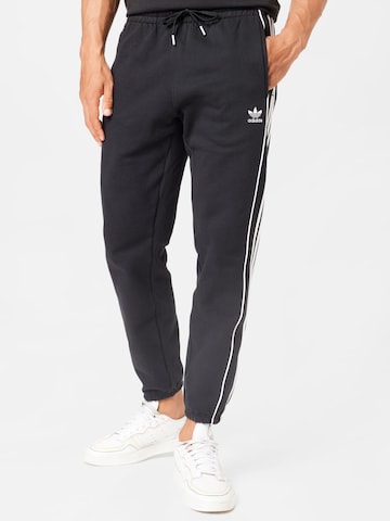 Effilé Pantalon 'Rekive' ADIDAS ORIGINALS en noir : devant