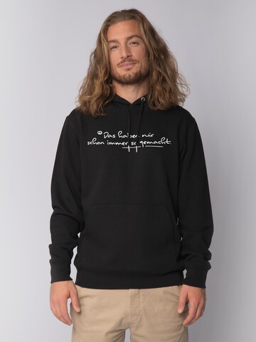 Watapparel Sweatshirt 'Das haben wir schon immer so gemacht' in Zwart: voorkant