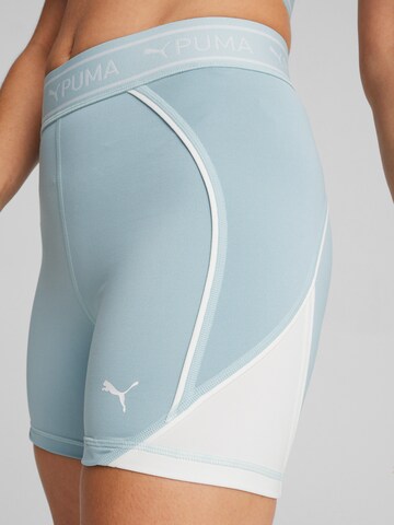 PUMA Skinny Sportbroek 'TRAIN STRONG 5' in Blauw