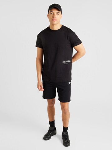 Calvin Klein Majica 'Off Placement' | črna barva