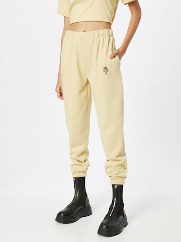 ABOUT YOU x INNA Tapered Pants 'Sandra' in Beige: front