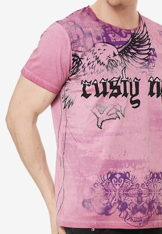 Rusty Neal Cooles T-Shirt mit Allover- Print in Pink