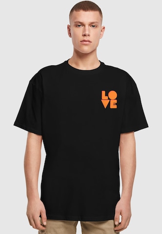 Merchcode Shirt 'Hugs & Love' in Schwarz: Vorderseite