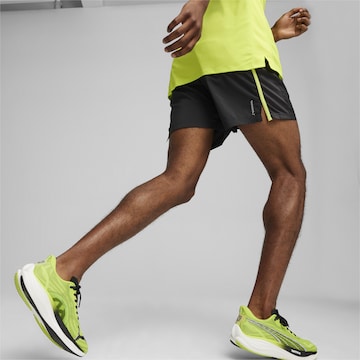 regular Pantaloni sportivi 'RUN FAVORITE' di PUMA in nero