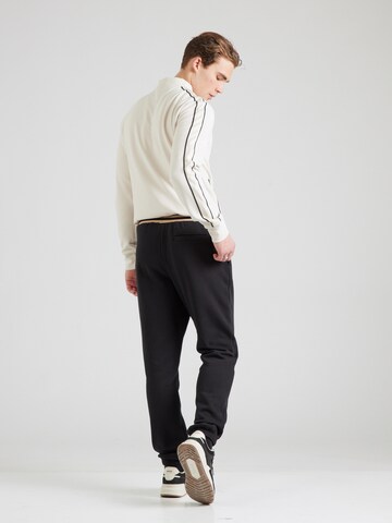 ELLESSE Tapered Trousers 'Guliana' in Black