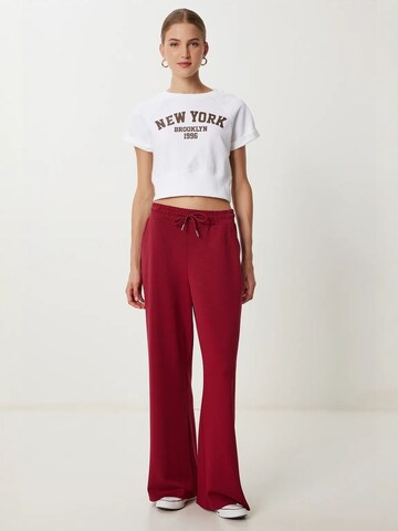 Wide leg Pantaloni di Happiness İstanbul in rosso