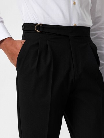 Antioch Tapered Pleat-front trousers in Black
