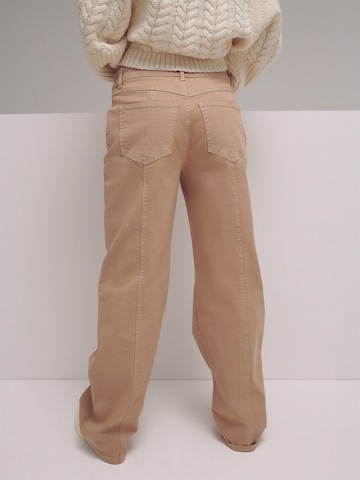 LENI KLUM x ABOUT YOU Wide leg Trousers 'Evelyn' in Beige