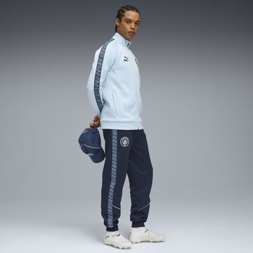 PUMA Tapered Sportbroek 'Manchester City King Anthem' in Blauw