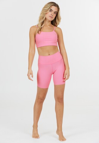Athlecia Regular Sports trousers in Pink