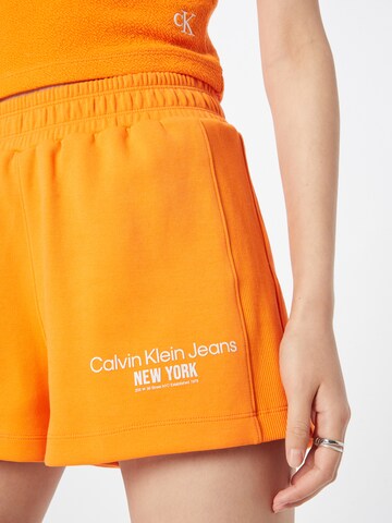 Calvin Klein Jeans Regular Trousers in Orange