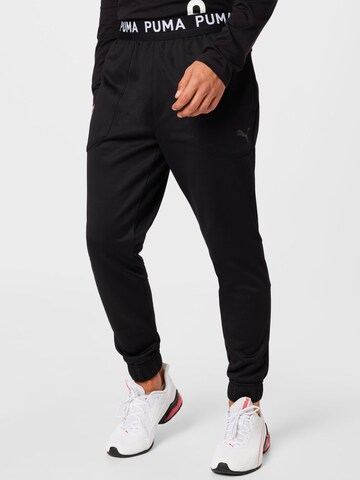 PUMA - Tapered Calças de desporto em preto: frente