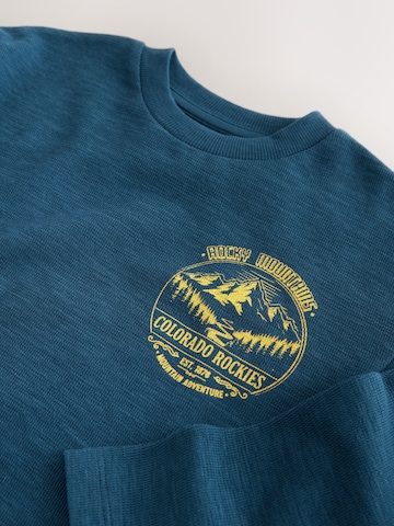Next - Camiseta en azul