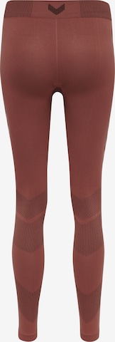 Skinny Pantalon de sport 'First' Hummel en rouge