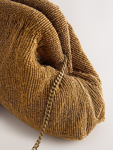 Pochette di Next in oro