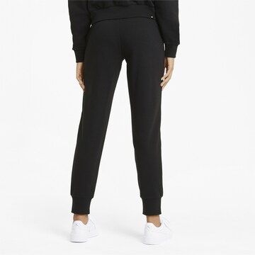 PUMA - Tapered Pantalón deportivo 'Essential' en negro