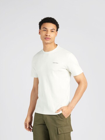 Tricou de la Calvin Klein pe bej: față