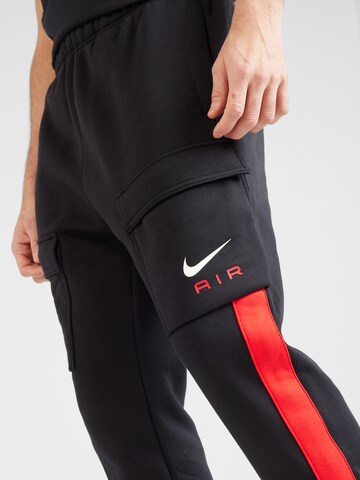 Tapered Pantaloni cu buzunare 'AIR' de la Nike Sportswear pe negru