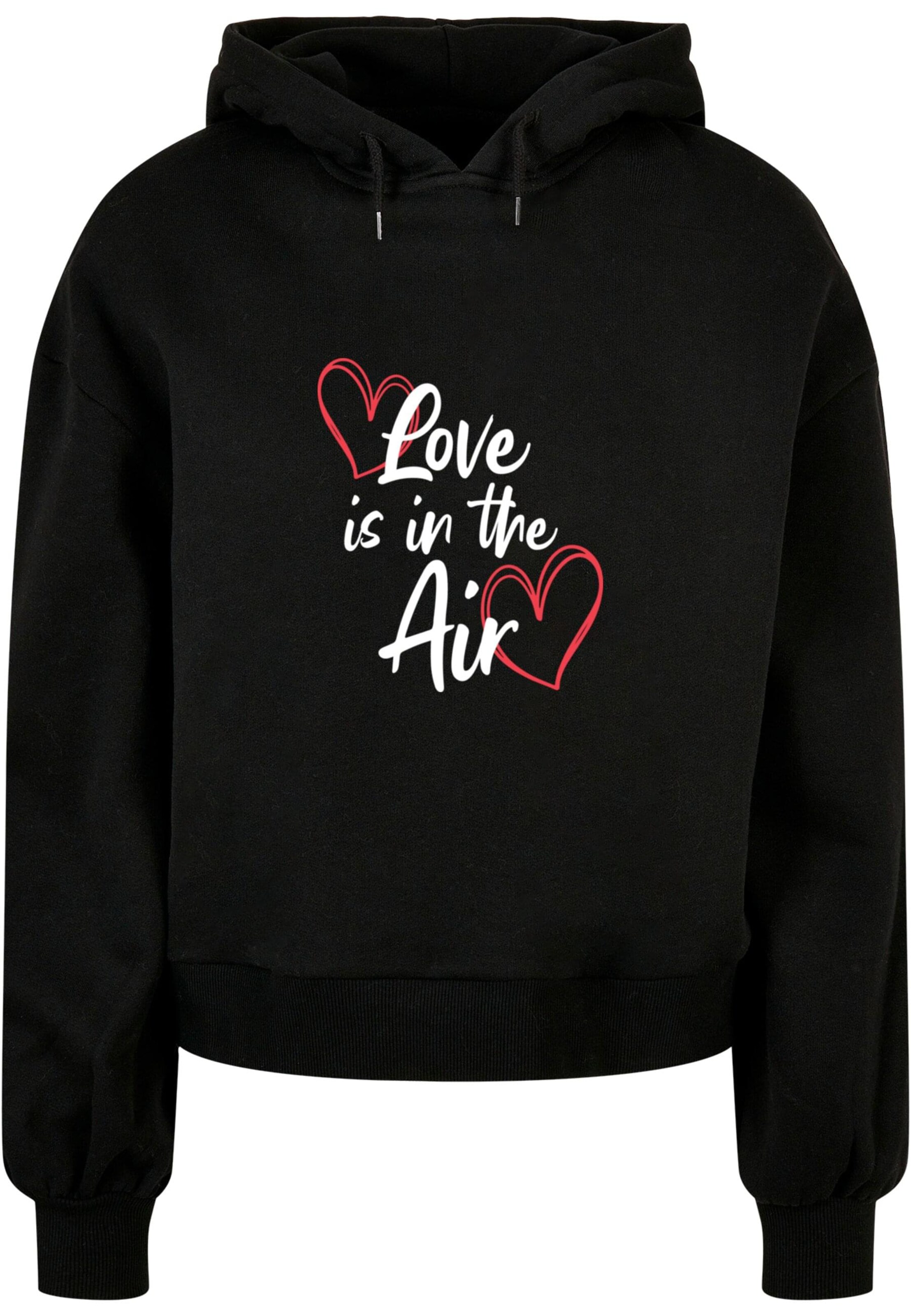 Merchcode Sweatshirt 'Valentines Day - Love is in the Air' in Zwart: voorkant